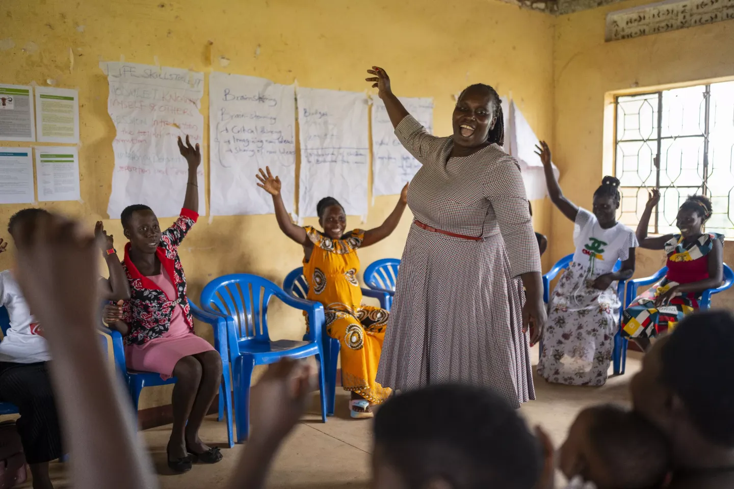 Teenage mothers participate in a life skills and mentorship session in Buhimba Town Hall, Kikuube District.