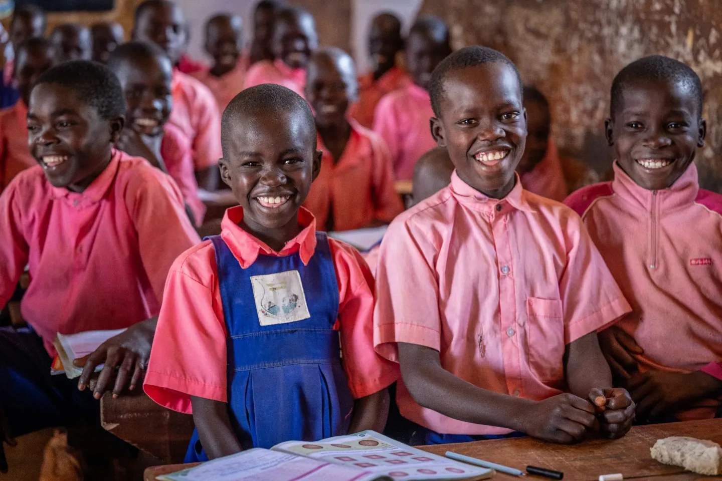 Aber Blessing, a 9-year-old learner with an eye condition, attends class at Kitgum Matidi Primary School. With support from the G4DU Programme, she is able to learn in an inclusive, encouraging environment&mdash;smiling her way through lessons as teachers ensure she receives the attention and support she needs to thrive.