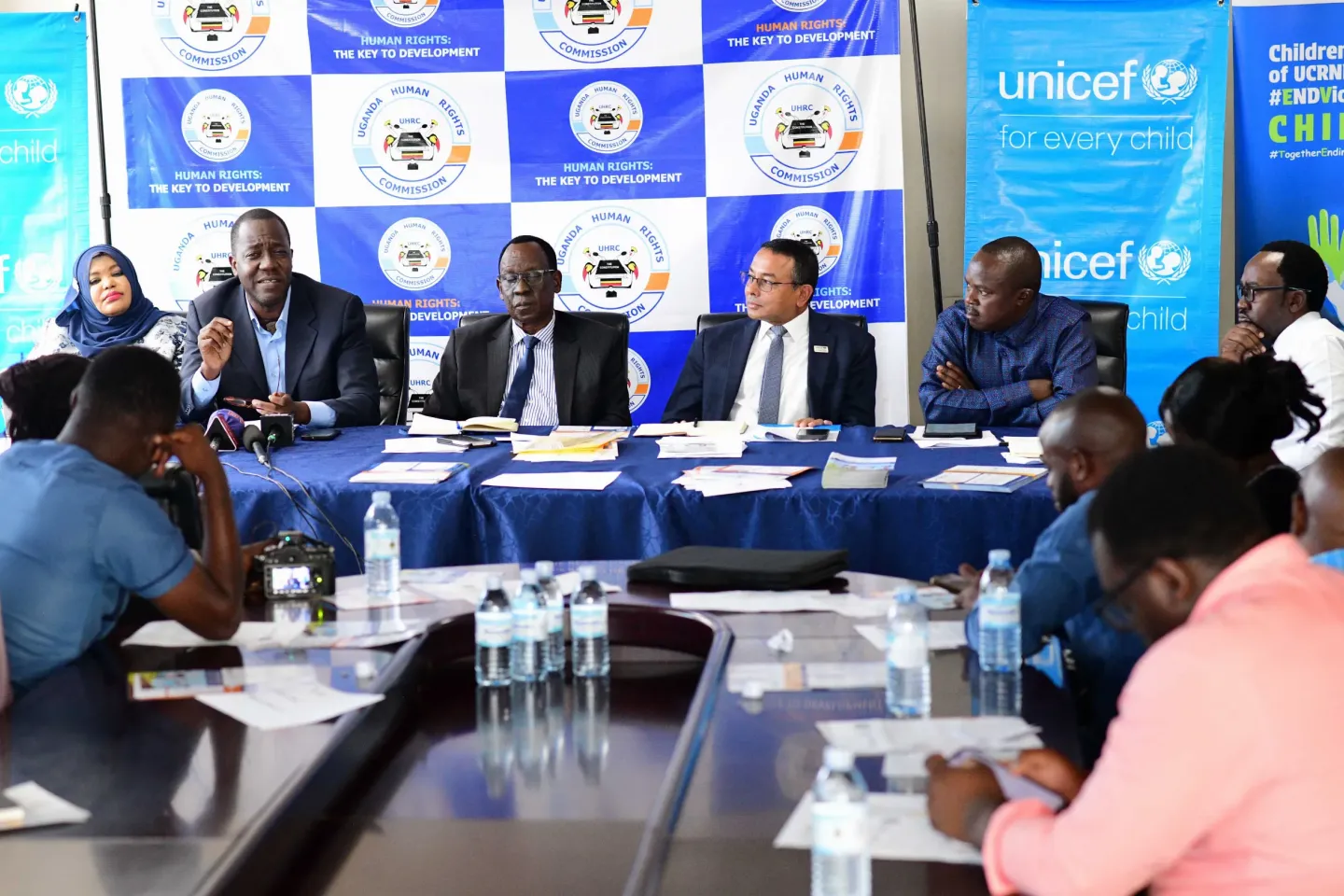 (L-R) Andrew Lubega, National Initiative for Civic Education in Uganda; Lamex Omara Apitta, a member of the Uganda Human Rights Commission; Robin Nandi, UNICEF Representative in Uganda; and other members of the Uganda Human Rights Commission, including Simeo Nsubuga and Crispin Kaheru, share a group picture after a joint press briefing in partnership with NICE-UG, UCRNN, UHRC and UNICEF on safeguarding the rights of children in the 2026 electoral period. This was on 8th December 2025 at the UHRC boardroom i