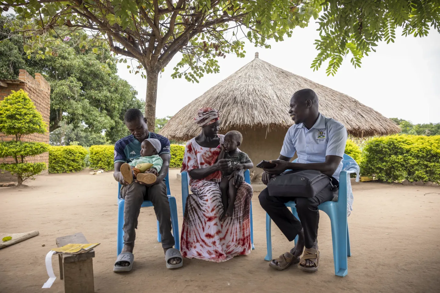 Zubairu Salim, an enrolled nurse and Nutrition Focal Person at Yumbe Health Centre IV, visits the home of Khadiri Aloro, 37, and Nafsi Nairah in Yumbe District, Uganda. During the visit, the children are followed up as part of their ongoing nutrition care. The nutrition response is supported by the Uganda Humanitarian Fund through UNICEF.