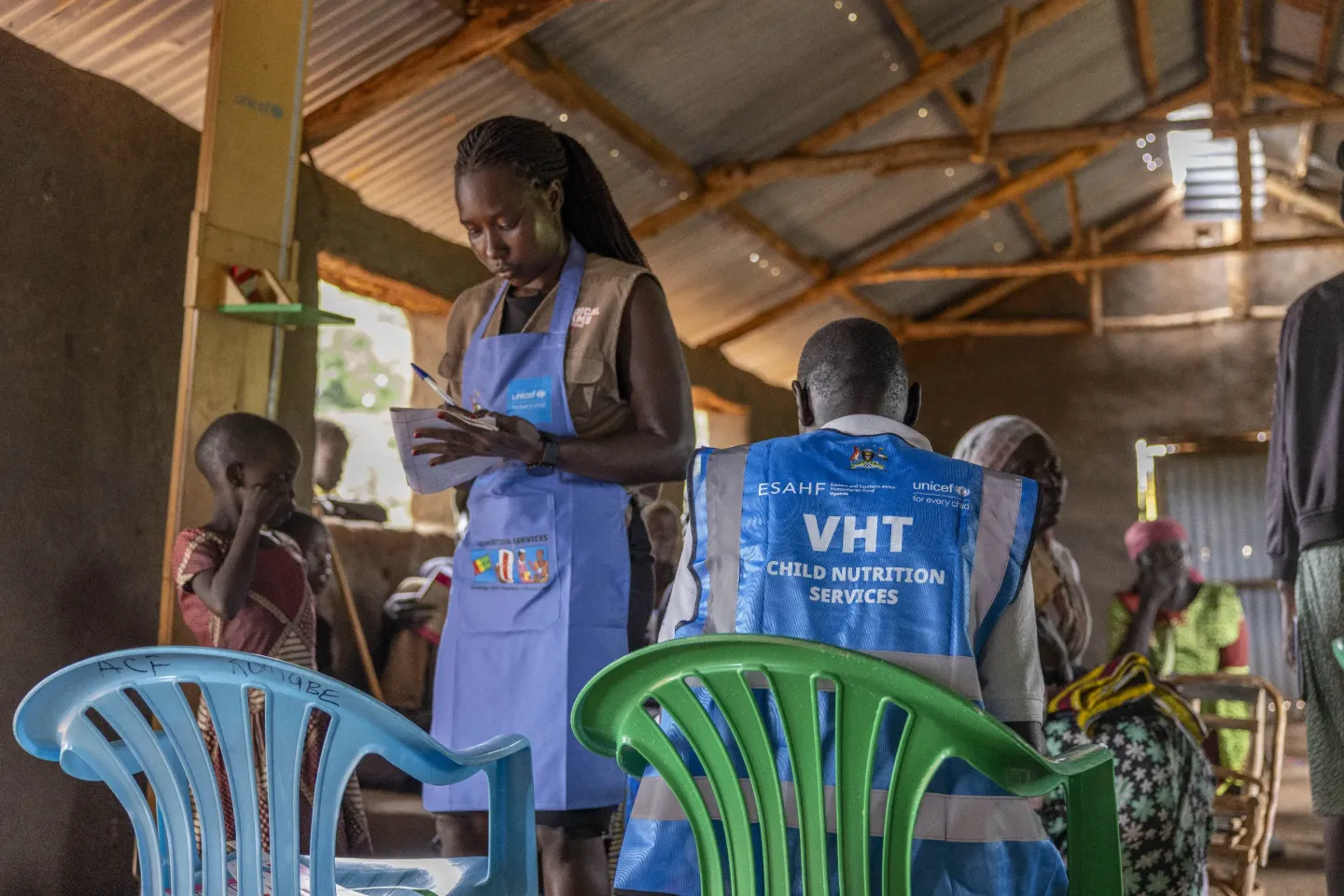 A nutritionist from Kombge Health Centre III records a child&rsquo;s measurements during an integrated health and nutrition outreach in Bidibidi Refugee Settlement, Yumbe District, Uganda.