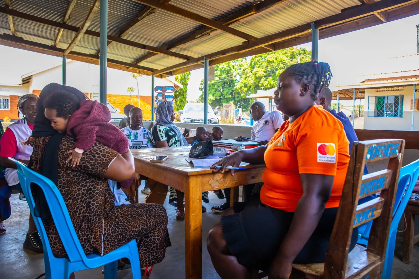 Namutosi Annet, a Community Health Extension Worker (CHEW) attached to &nbsp;Namakwekwe Health Center III, Mbale city attends to Nyamera Sumini and her daughter during a routine clinic.