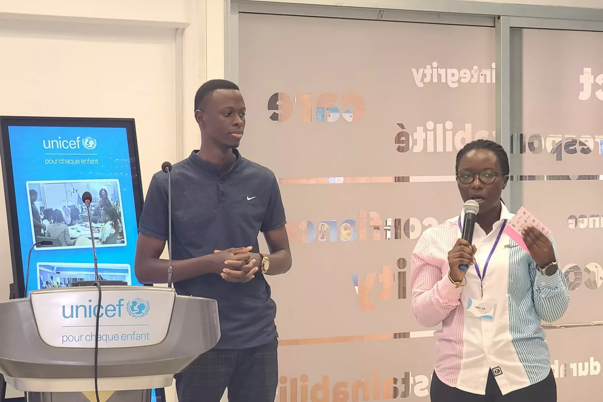 Esther Kitumaini Presenting the Uganda Advocacy Strategy, standing next to her is Jamada Kalinda a UNICEF Uganda U-Reporter 