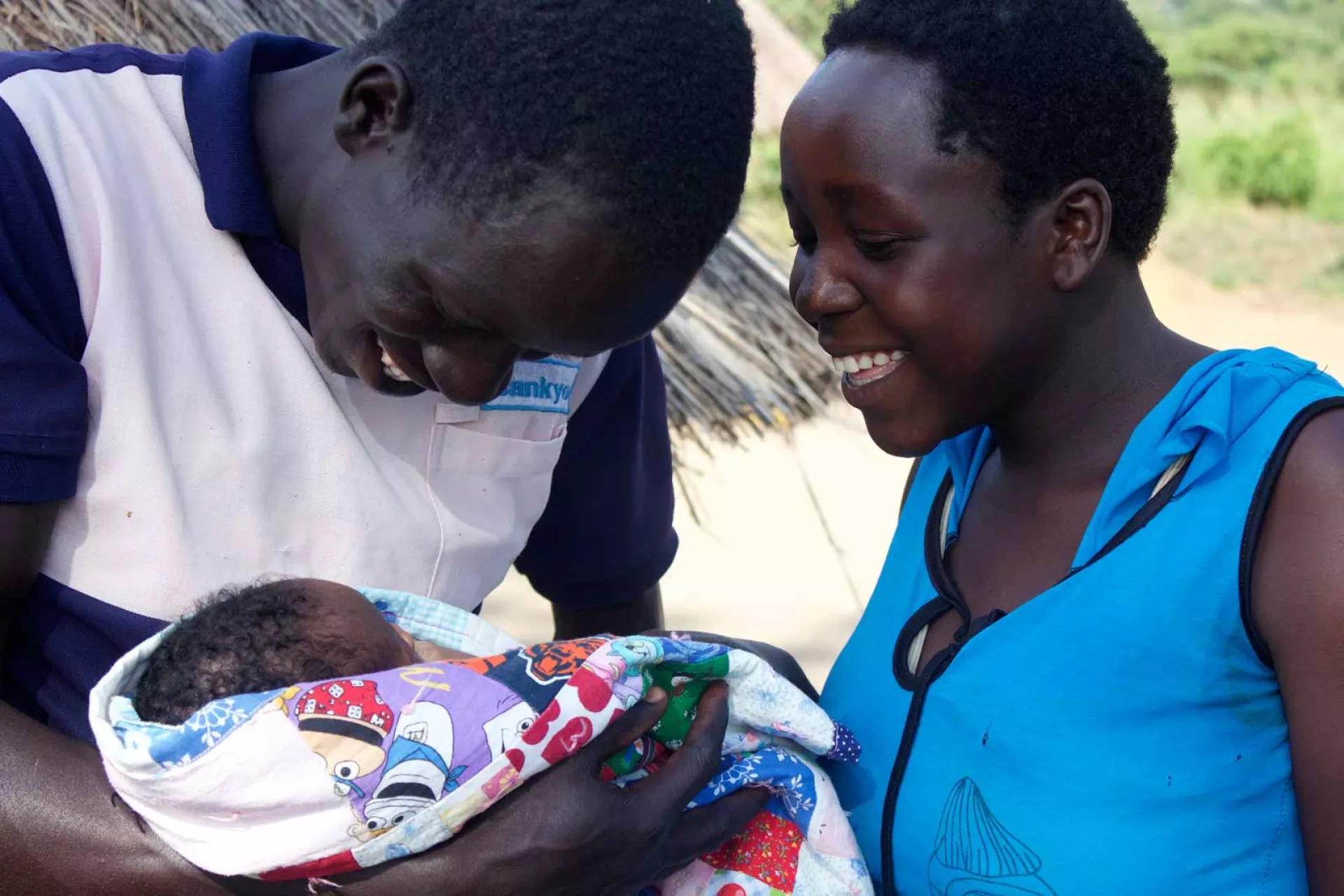 Parents cradle a baby