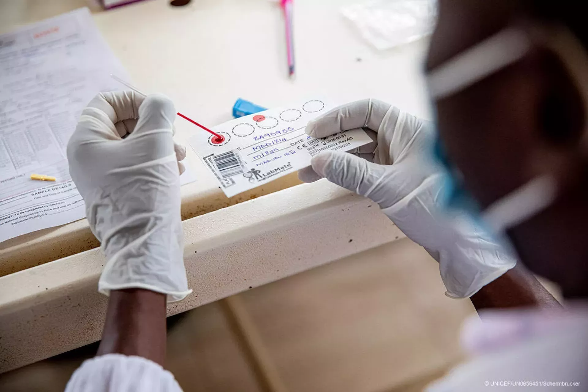 Margret and her son Ronald (9 yrs) are HIV positive. Ronald's viral load is tested by the laboratory at the Madudu Health Facility Mubende, Uganda. Ronald is currently on medication.