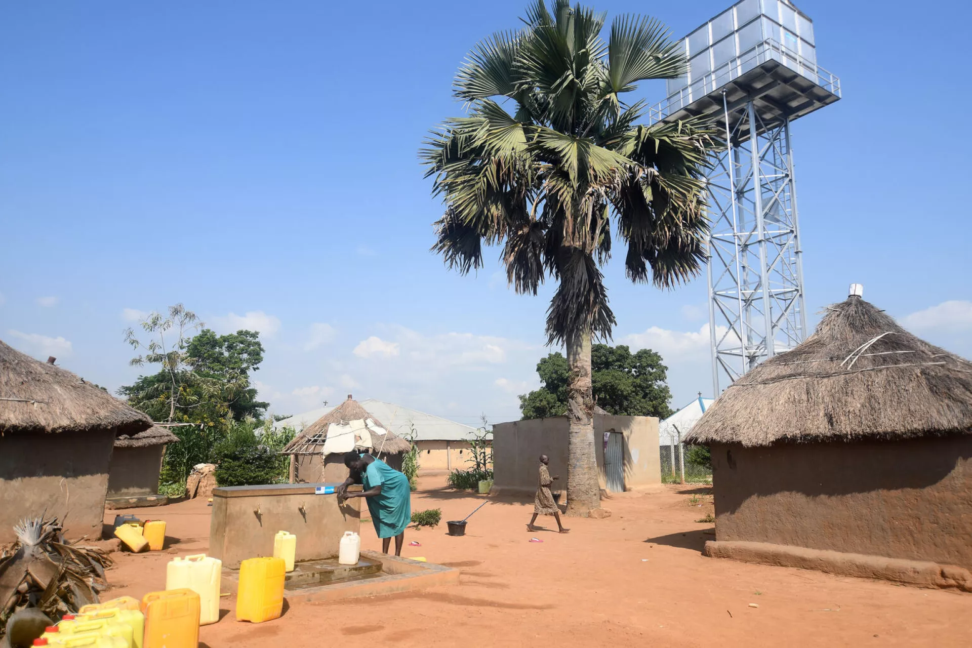 Refugee collecting water