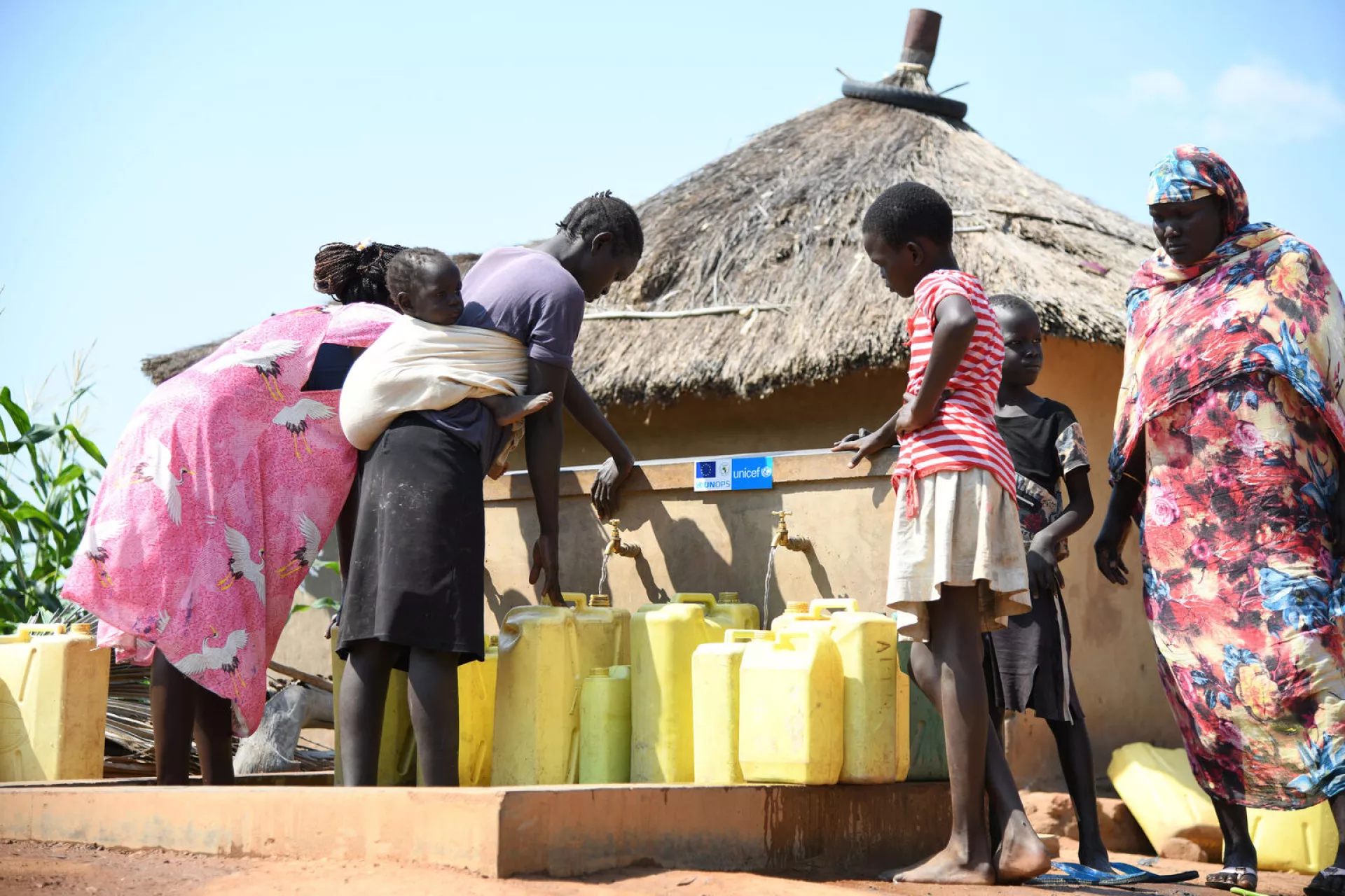 women and children fetching water