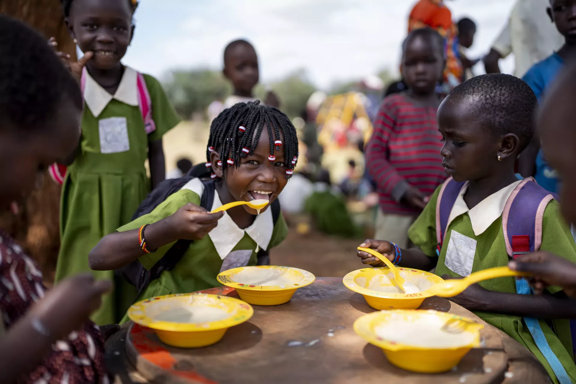 Children enjoy their breakfast at an Early Childhood Development centre in Loroo, Amudat District.