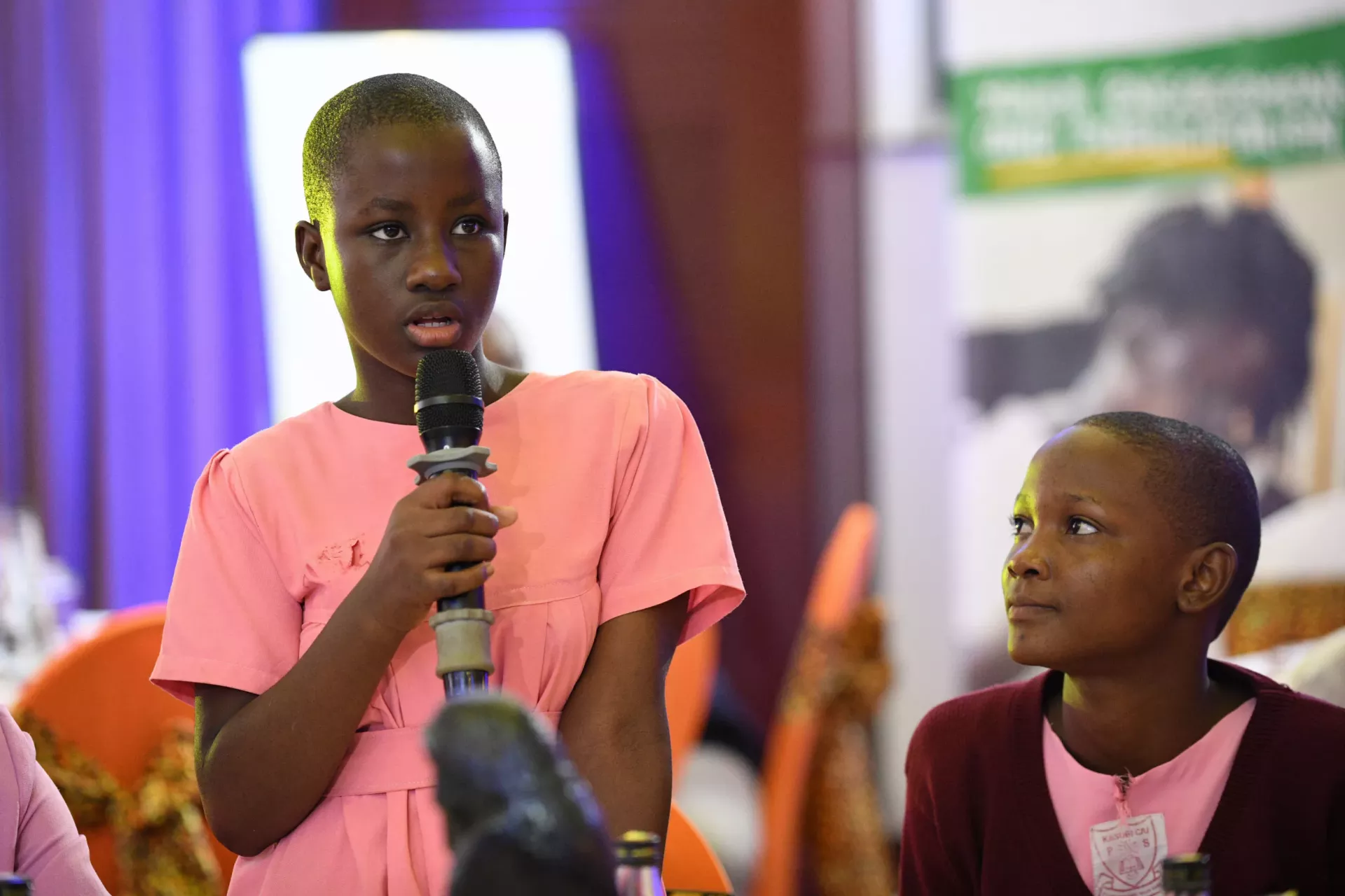 A pupil from Kasubi Church of Uganda Primary School participate in the launch of the National Coalition to End Child Poverty in Uganda.