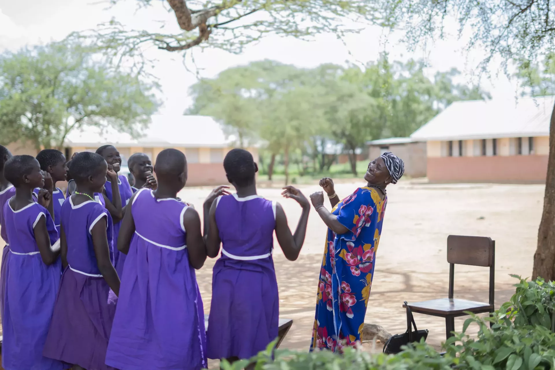 Pupils at Lokodiokodioi Primary School sing songs during a group session with a parasocial worker in Napak District. 