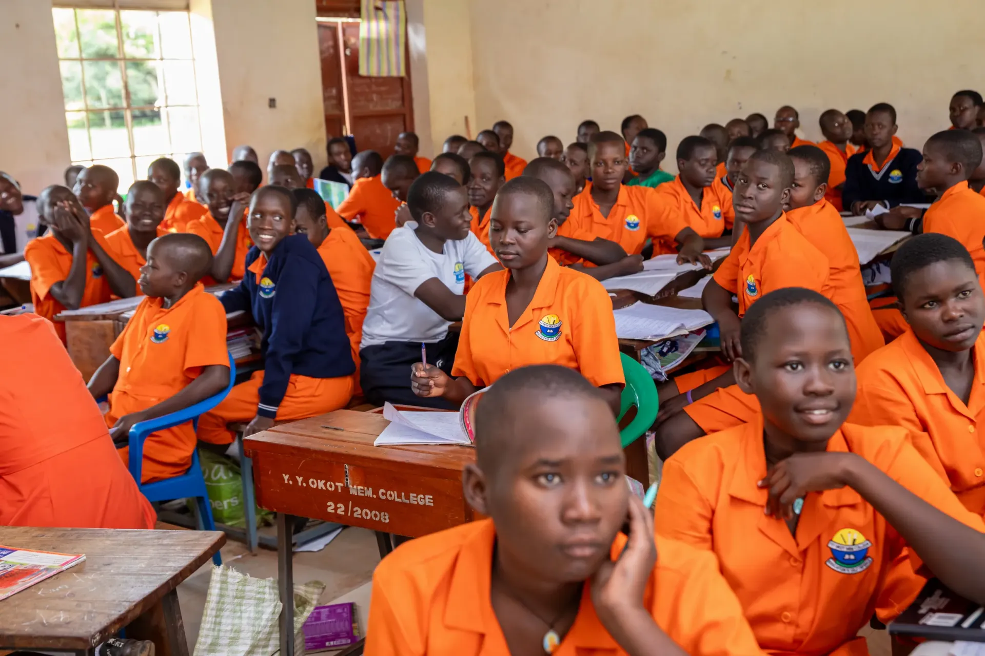 Senior One class students of Y.Y. Okot Memorial College in Kitgum District. Despite progress, Uganda faces major challenges in providing accessible basic education to children and adolescents, with low transition and retention rates to secondary levels as fundamental challenges to be addressed, particularly among girls.