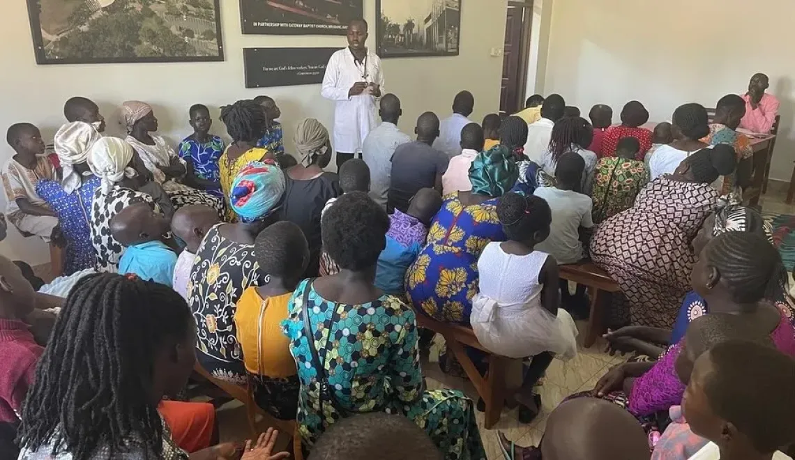 Dr Denish Kilama leads a monthly group counselling and health education session for children living with sickle cell disease and their caregivers at Yotkom Hospital in Kitgum District, northern Uganda. The community of families was formed by Dr Kilama and now meets every month.