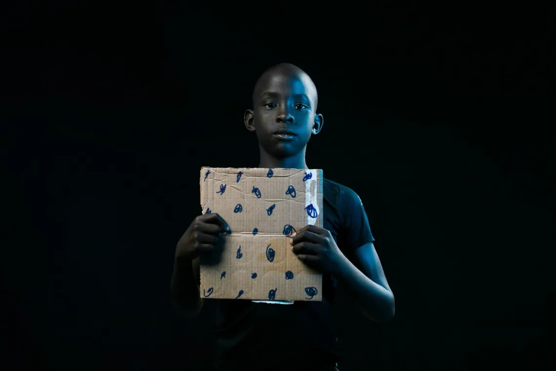 Abednego with an improvised chess game set. &ldquo;Because mental health is around what happens in one&rsquo;s head, I read story books, sleep and play chess to clear my mind. &nbsp;Government should buy more books for libraries and materials for playing games to avoid over studying.&rdquo; Abednego Esianaedeke, 10