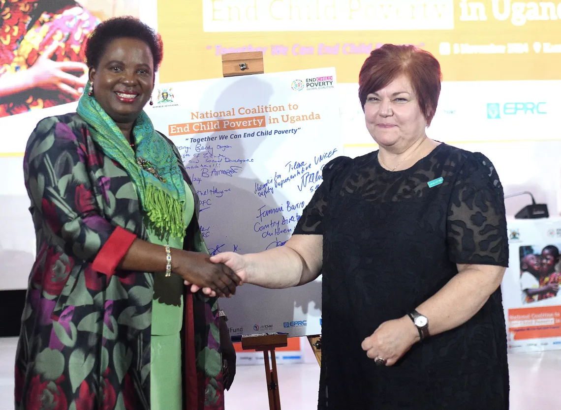 The Minister of Gender Labour and Social Development Hon. Betty Amongi Ongom and Deputy Representative Programmes UNICEF Uganda Margarita Tileva interact at the launch the National Coalition to end child poverty in Uganda.