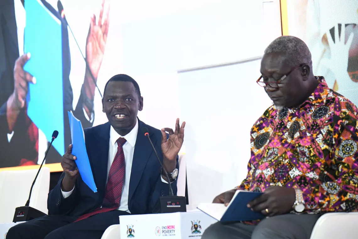 Panel Moderator Moses Sichei, Head of Social Policy, UNICEF Uganda and Mondo Kyateka, Asst Commissioner Youth Affairs, Ministry of Gender Labour and Social Development during a panel discussion at launch of the National Coalition to end child poverty in Uganda. 