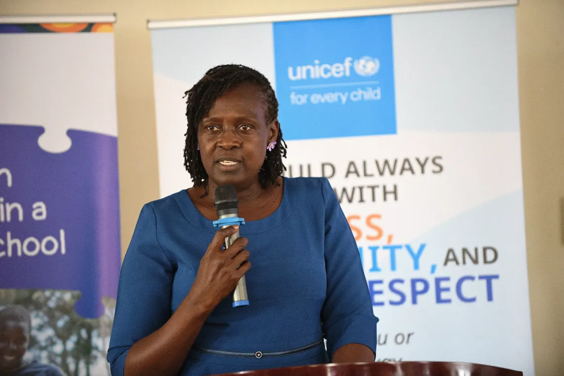 Irene Oluka, Child Protection Officer UNICEF makes her remarks during the Violence Against Children in Schools Survey (VACiS) validation workshop.