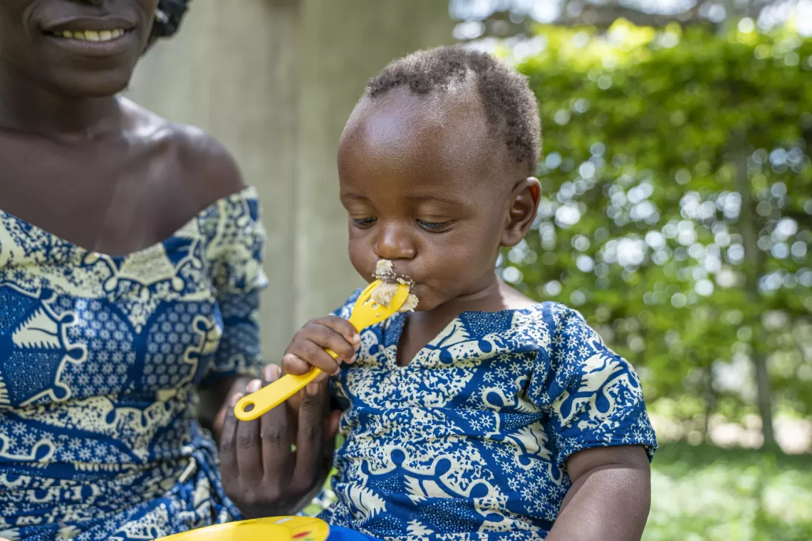 One-year-old baby feeds on food mixed with the egg powder during the Egg Powder Initiative for Children (EPIC) launch event in Kamwenge District on April 23, 2025.