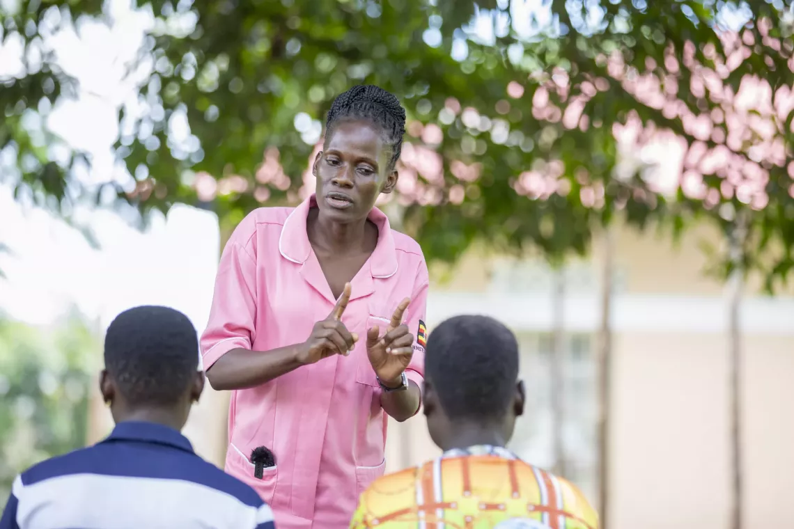 Midwife Sarah Mirembe attends to two expectant adolescents, explaining the importance of antenatal care, at St. Matia Mulumba Health Centre III, Buswale Sub-county, Namayingo District &ndash; 7 May 2025.