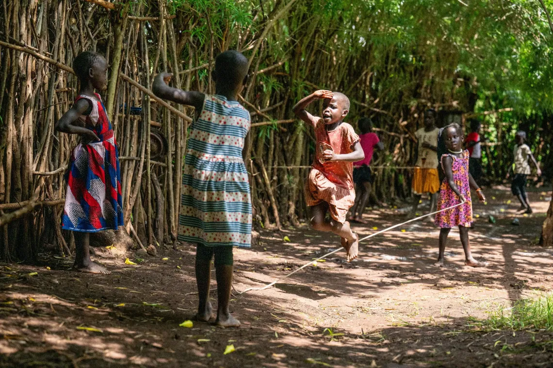 Mercy Doreen Pulkol plays with her siblings while at home.