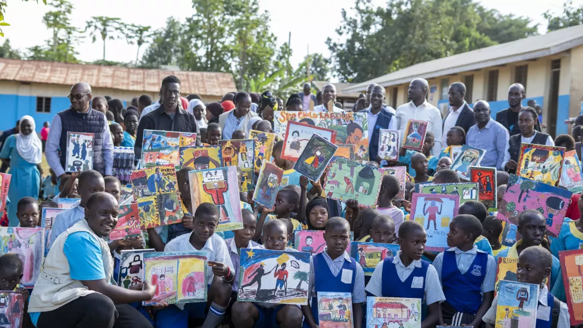 Children at Sala Good Primary School in Kalungu District display their artwork depicting the dangers of child labour, their rights and ideas for ending it.
