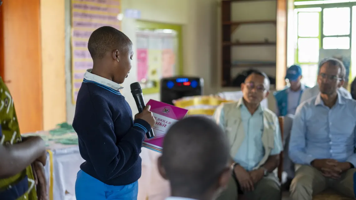 Keria Akeza, 16, a refugee from the Democratic Republic of Congo and member of the Life Skills Club at Rwamwanja Secondary School, introduces a session using the Life Skills Toolkit for adolescents. Through the club, students build confidence, emotional awareness, and communication skills promoted under UNICEF&rsquo;s education and adolescent development programmes.