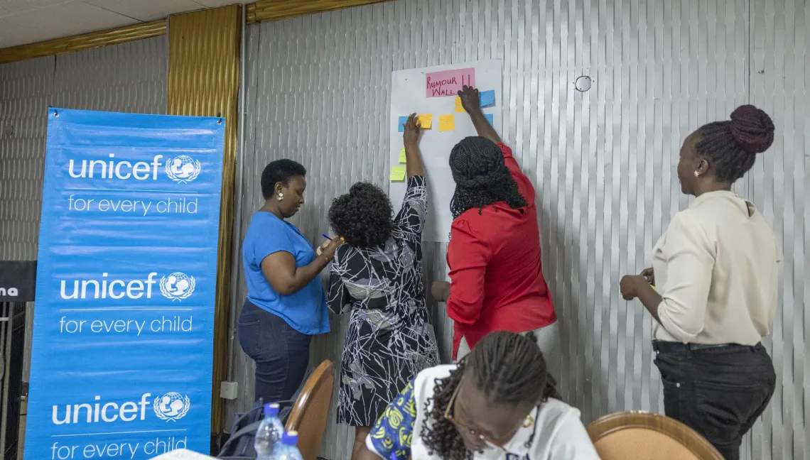 Government Communication Officers contribute examples of rumours and misconceptions about Ebola to the "Rumour Wall" during a practical exercise on identifying and responding to misinformation.