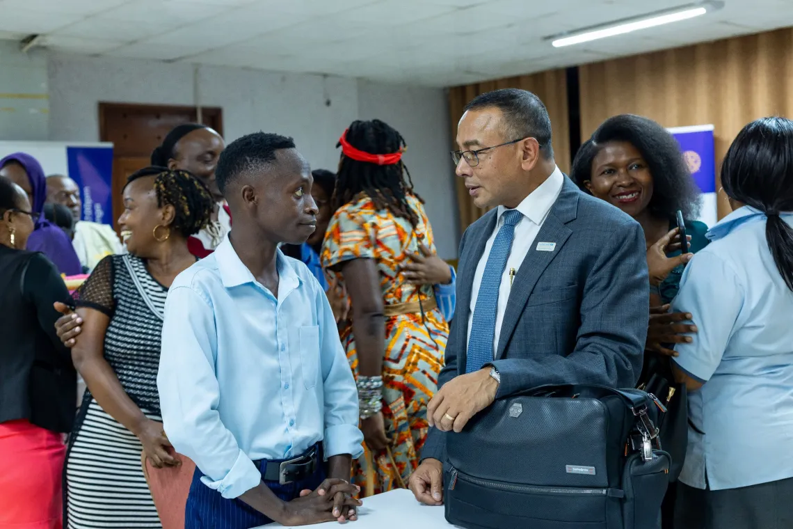 Dr. Robin Nandy, UNICEF Uganda Country Representative, speaks with an attendee before the start of the inaugural fellowship of the Rotary Club of Kisugu Victoria View for the 2026/2027 Rotary year at Hotel International Muyenga in Kampala, Uganda, on July 7, 2026. 