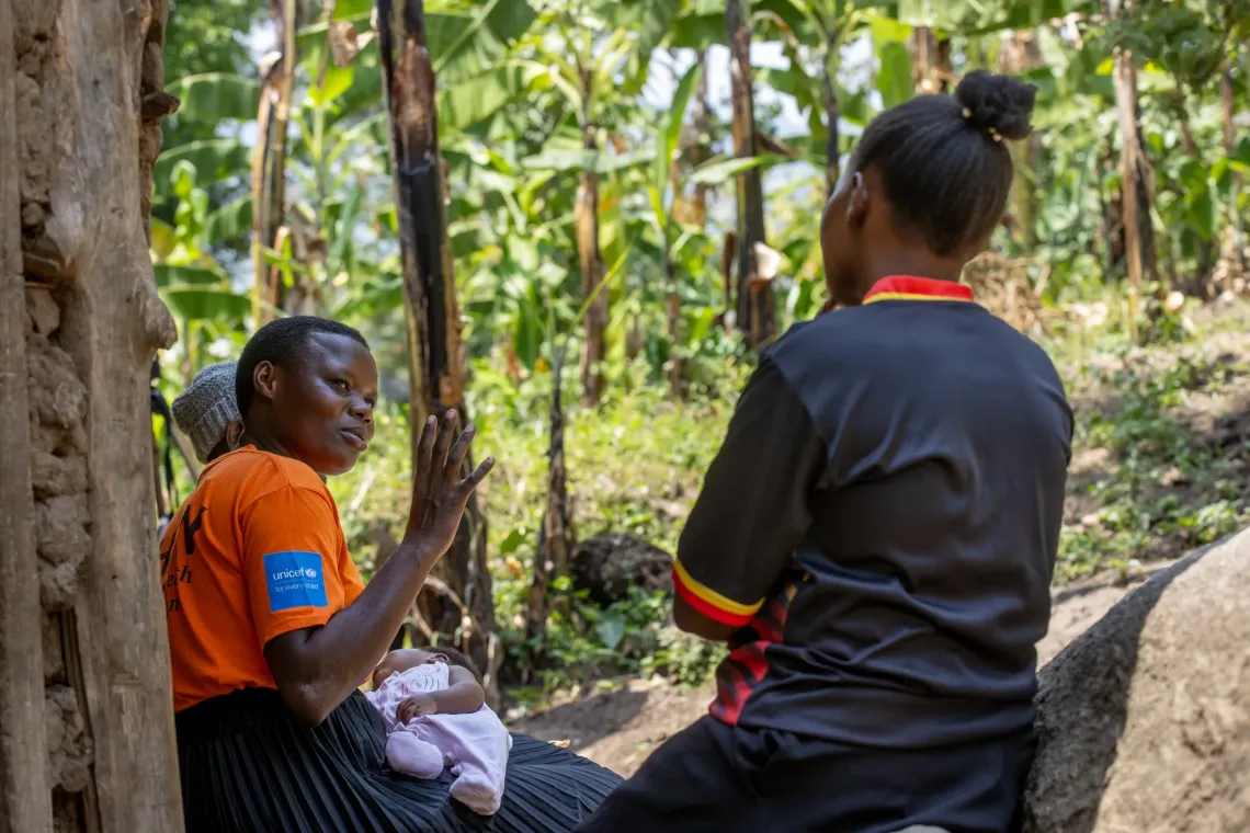 Community Health Extension Worker and VHT walk to Grace&rsquo;s house.  