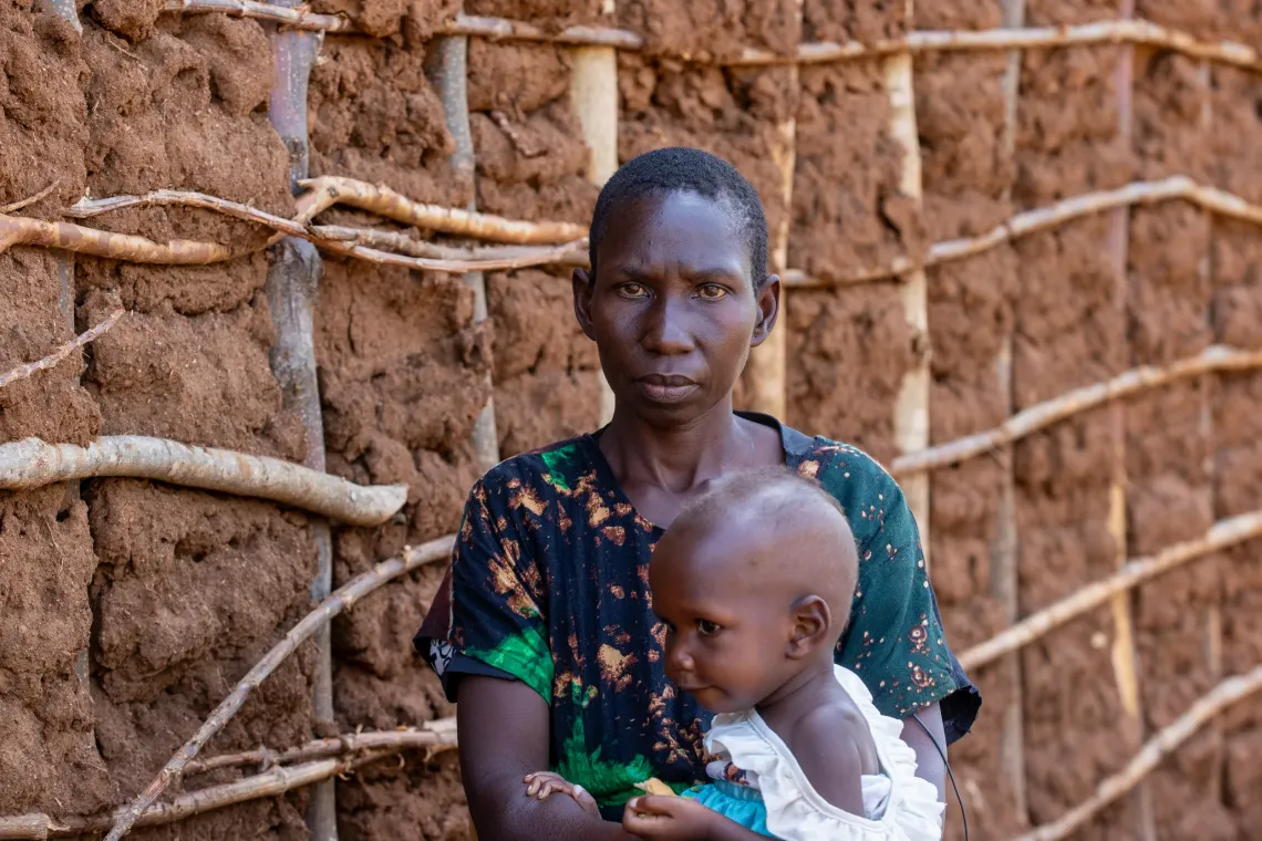 A portrait of Grace Nabwire, whose daughter was found severely malnourished by a Community Health Extension Worker (CHEW) and accodingly referred for further management at Masafu General Hospital in Busia District and progressing well on the road to total recovery.