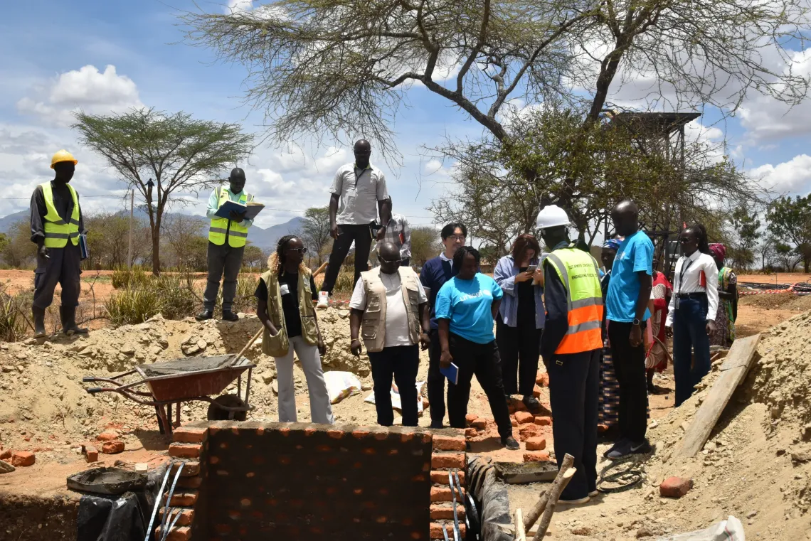 KOICA Country Director Mr Jongsu Yi, UNICEF Chief of WASH, Environment and Climate Action Mr Lalit Patra and Amudat District officials visit the site of a water facility under construction at Nabokotom Primary School in Amudat District during a joint UNICEF-KOICA monitoring visit. 