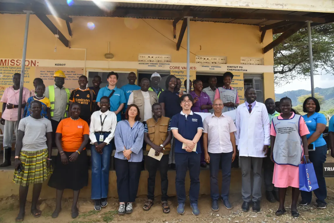 KOICA Country Director Mr Jongsu Yi (in blue T-shirt) with KOICA and UNICEF staff and health workers at Lemusui Health Centre III in Nakapiripirit District, during a joint UNICEF-KOICA monitoring visit. 