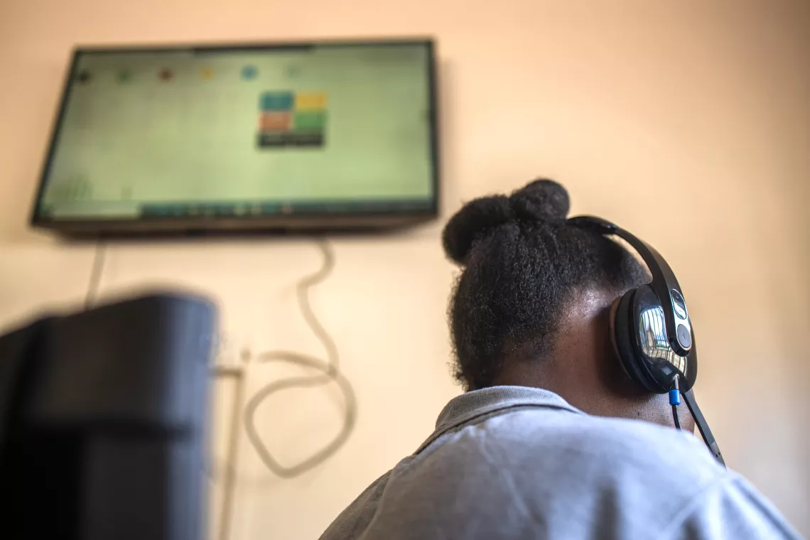 A case worker attends to a caller in the service contact Centre at the SAUTI-116 Helpline offices in Kireka, Kampala.