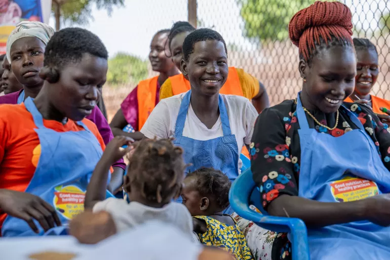 Care group mothers in Nyumanzi Refugee Settlement work together to strengthen child nutrition practices.