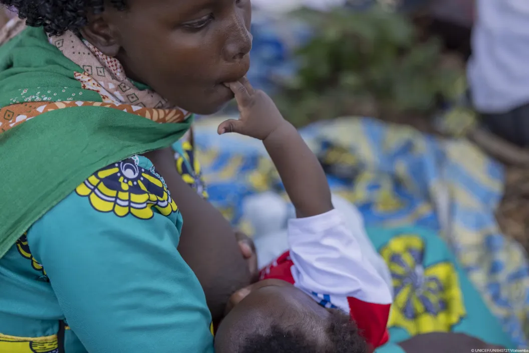 A mother breastfeeding 