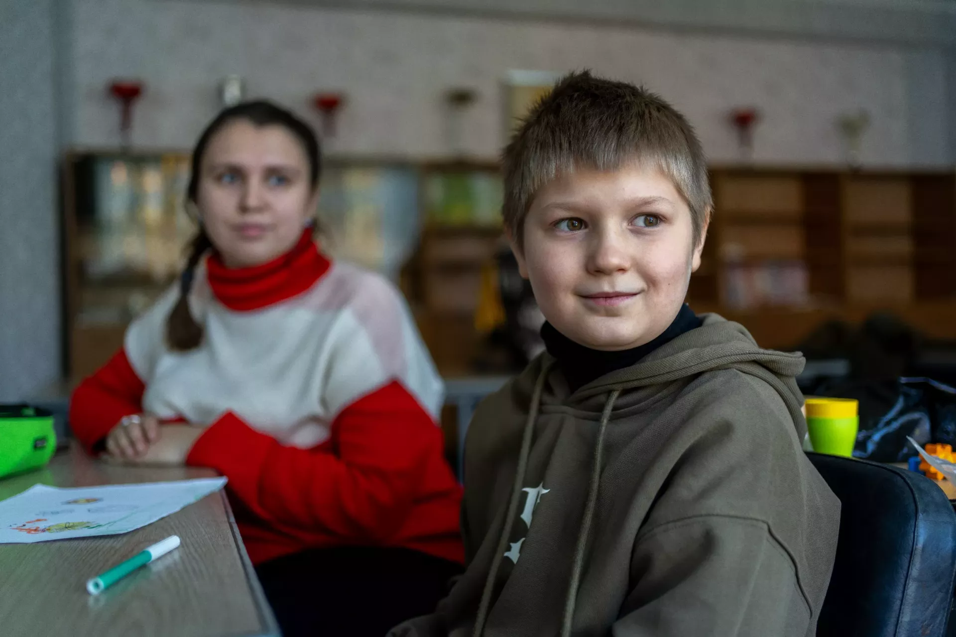 Nine-year-old Vanya with a therapist during rehabilitation