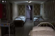 The hospital shelter is located in a semi-basement and has five exits. The windows are blocked with sandbags, the walls are lined with beds that can accommodate all the patients, and the spacious storage rooms have enough space for the entire hospital staff.
