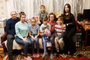 Foster parents Nataliia (49) and Leonid (47) with their children at their home in the village of Chabanivka