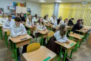 School students sitting at the lesson
