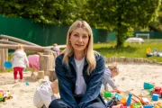 Preschool teacher at the playground near the kids