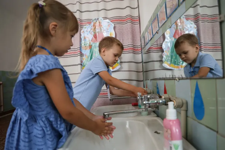 A photo of children washing hands