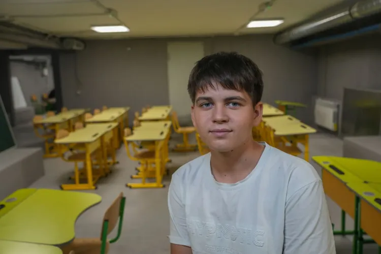A teenage boy in a school shelter