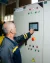 A water utility worker is checking the equipment