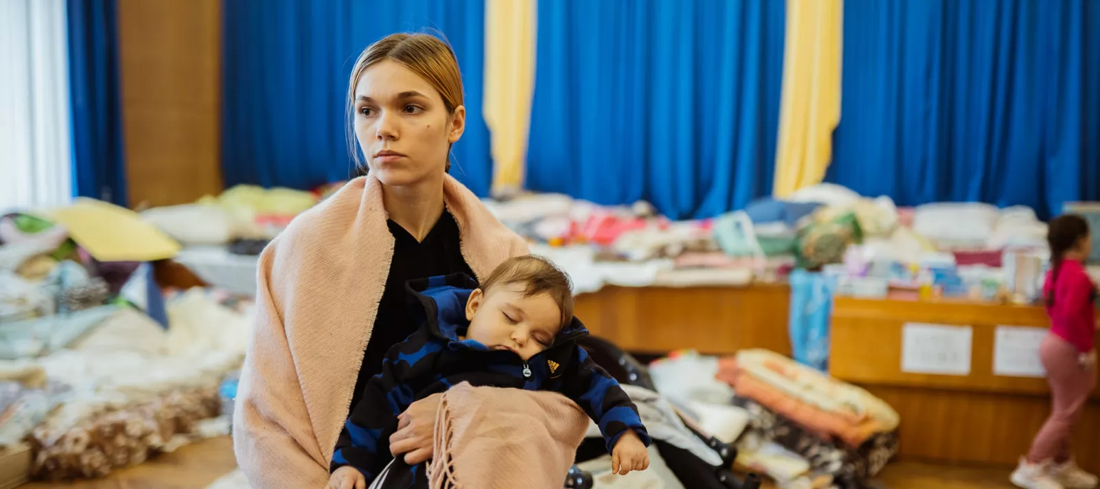 On 28 February 2022, Salah-Arsalan, a 4-month-old baby from Cherkasy sleeps in the arms of its mother Valeria at an air-raid shelter in Lviv.