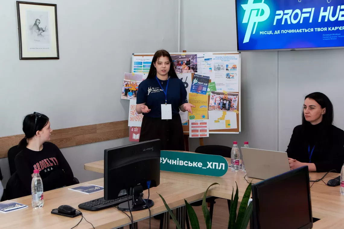 photo of Kateryna presenting a career guidance project to students