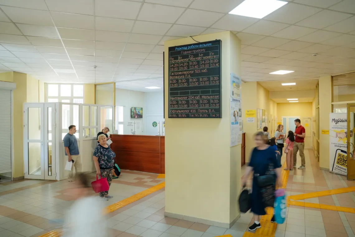 People walking in the lobby at the hospital.