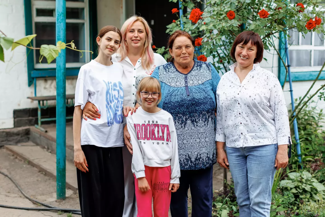 Olena with her mother Lyubov and daughters Polina (14 years old) and Angelina (9 years old) and Natalia Gavrylenko, head of the children's service of the executive committee of the Khorolsk City Council.