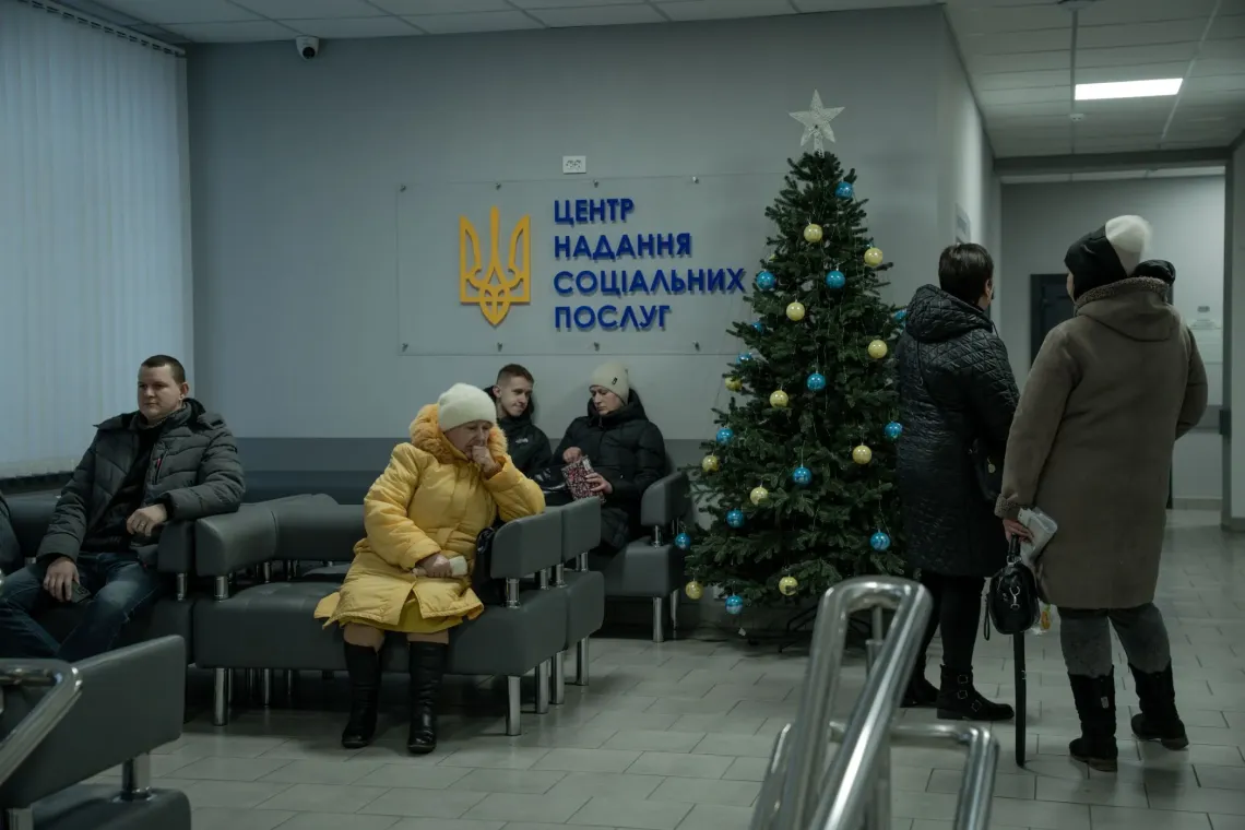 People at the lobby of the local social services centre, eastern Ukraine.