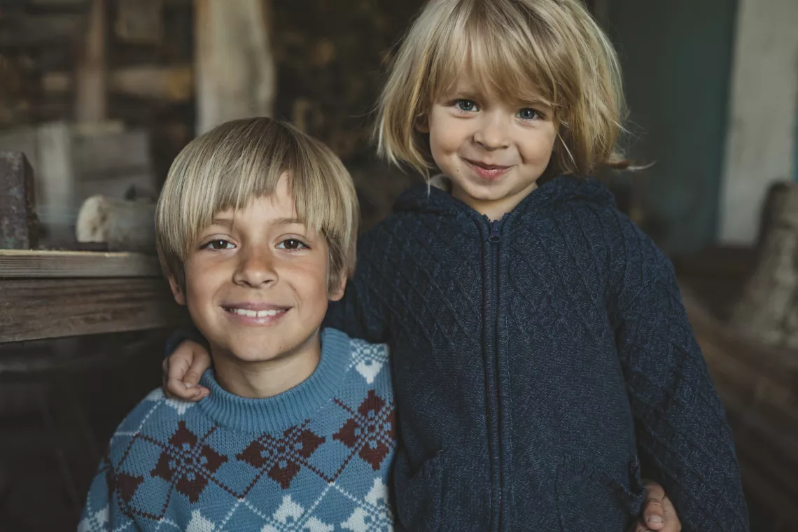 8-year-old Elvin and 3-year-old Leonard are playing and drawing at their temporary house in Khmelnytskyi region. The family used to have an apartment in Irpin, in a house, which is now half-destroyed. But when the war started they had to flee.
