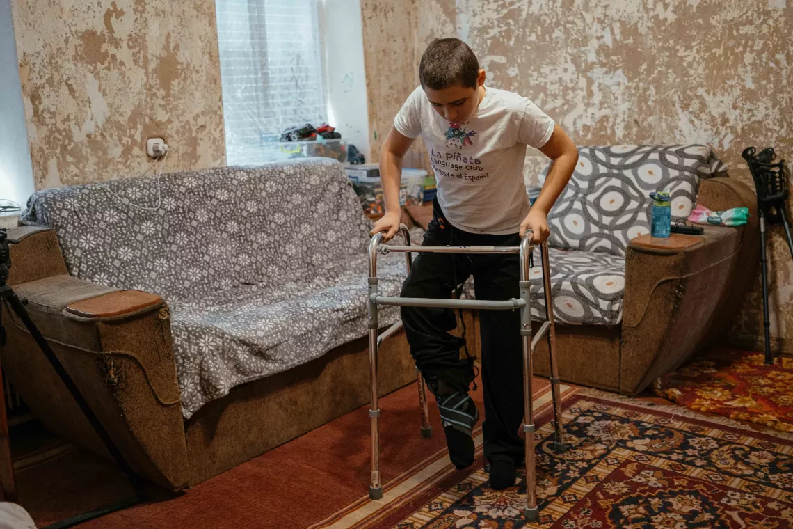 Nazar is learning to move around with the help of rehabilitation walkers