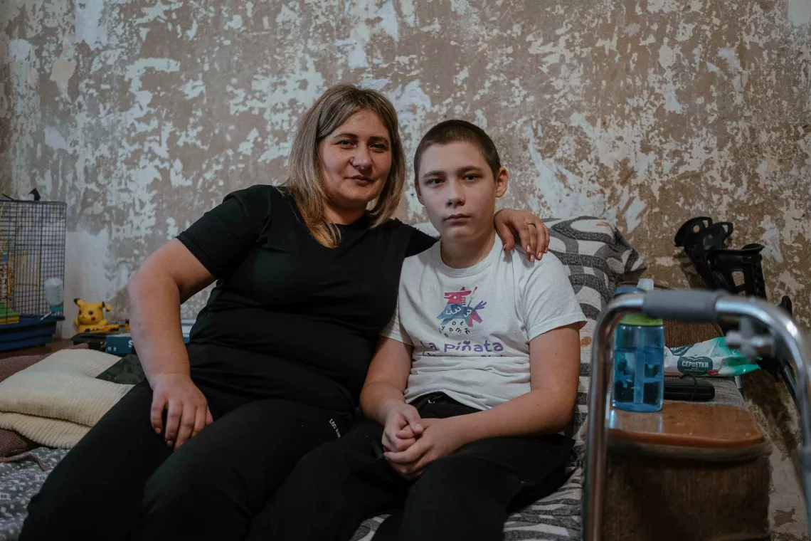 Nazar with his mother on the couch